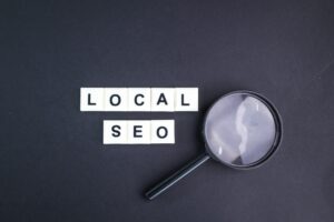 magnifying glass with local seo alphabet words.
